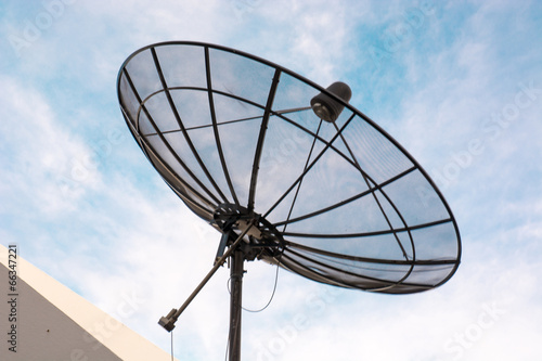 Satellite dish in blue sky