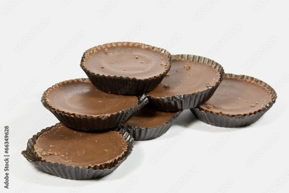 Pile of Six Brown Chocolates in Protective Papers Pile of Six Brown Chocolates in Protective Papers