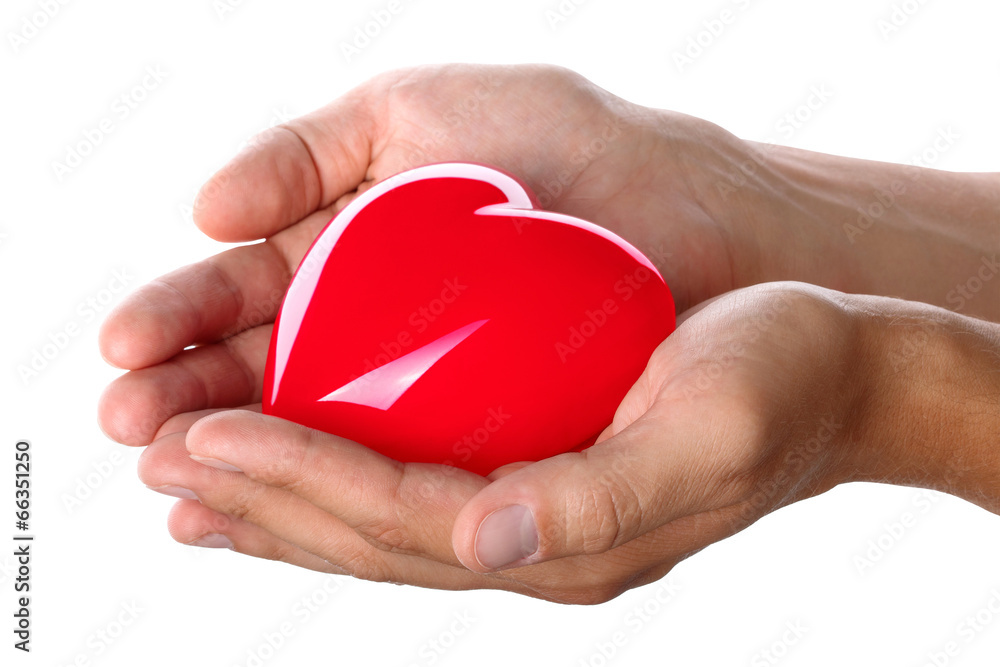 Male hands giving red heart