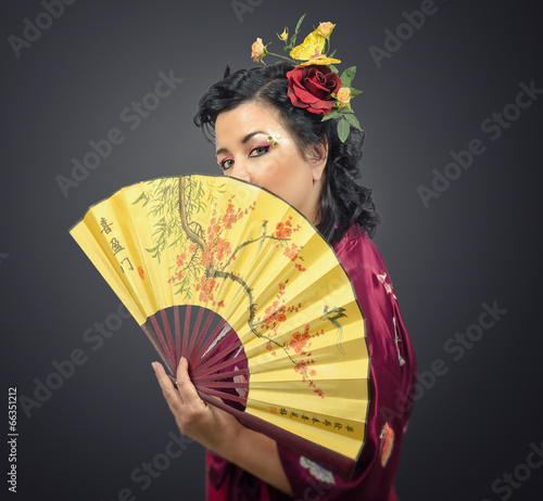 Kimono white woman holding traditional fan