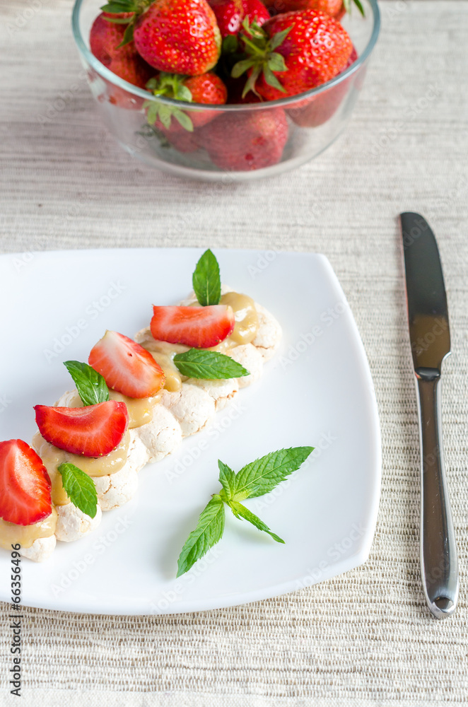 Meringue cake with cream and fresh strawberries Meringue cake with cream and fresh strawberries