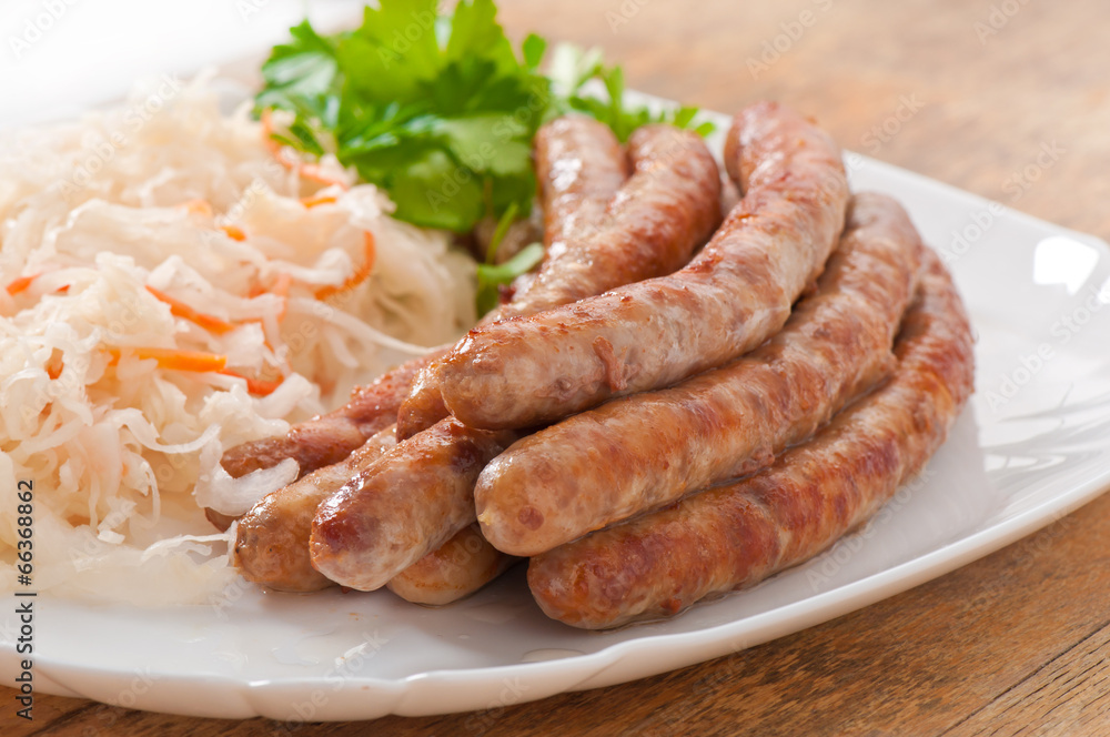 Bavarian fried sausages on sauerkraut Bavarian fried sausages on sauerkraut