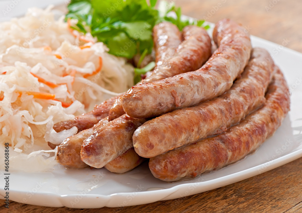 Bavarian fried sausages on sauerkraut Bavarian fried sausages on sauerkraut