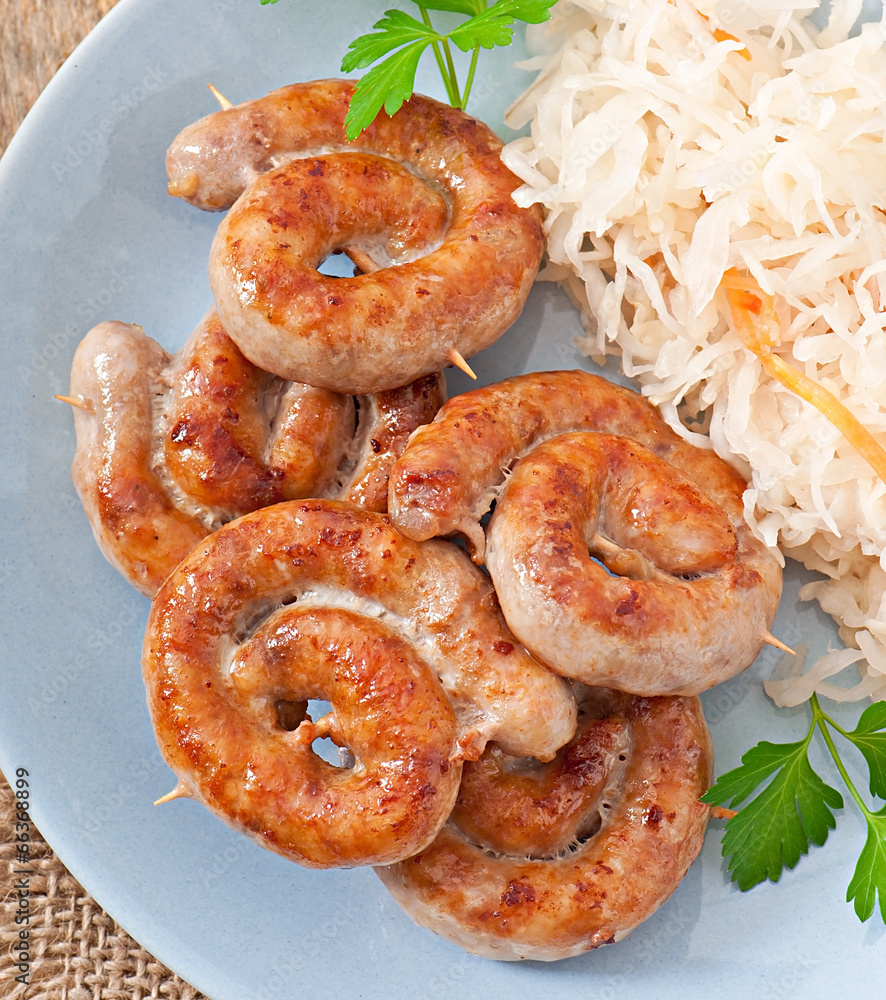Bavarian fried sausages on sauerkraut Bavarian fried sausages on sauerkraut