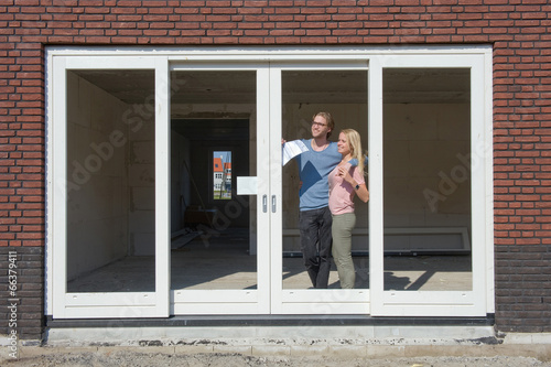 Young couple on construction site © Robert Hoetink