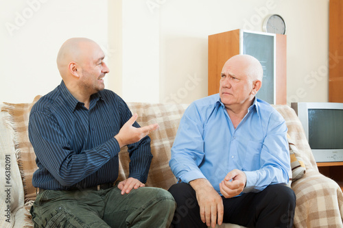 men talking   at home