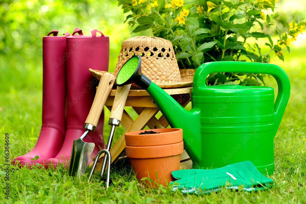 Gardening tools on green background and grass Gardening tools on green background and grass