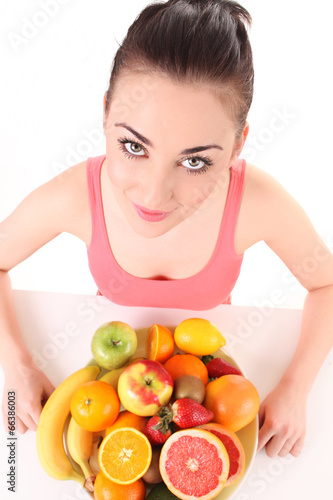 Brunette woman with fresh fruits