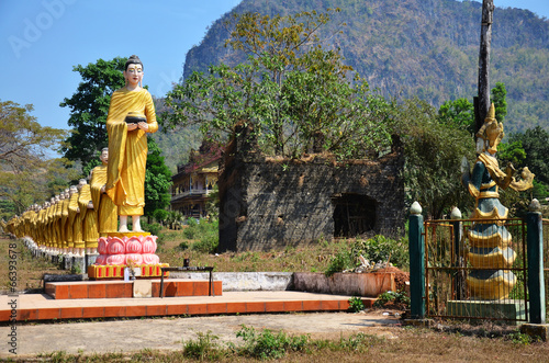 Buddha image statue at Tai Ta Ya Monastery or Sao Roi Ton Temple photo