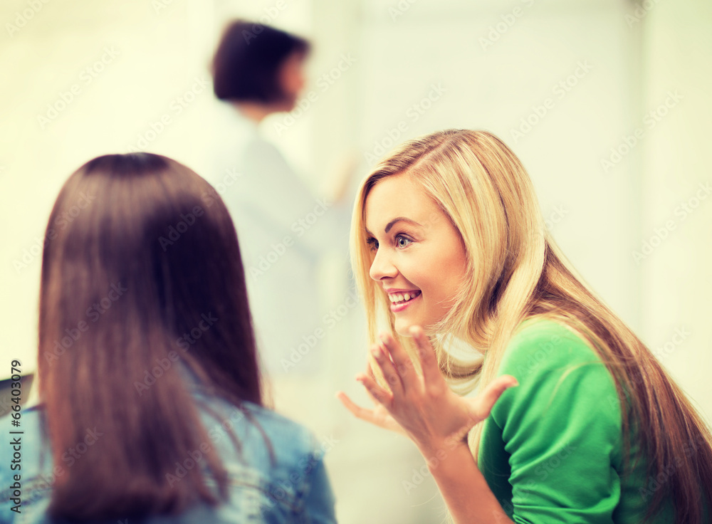 student girl gossiping in lecture at school student girl gossiping in lecture at school