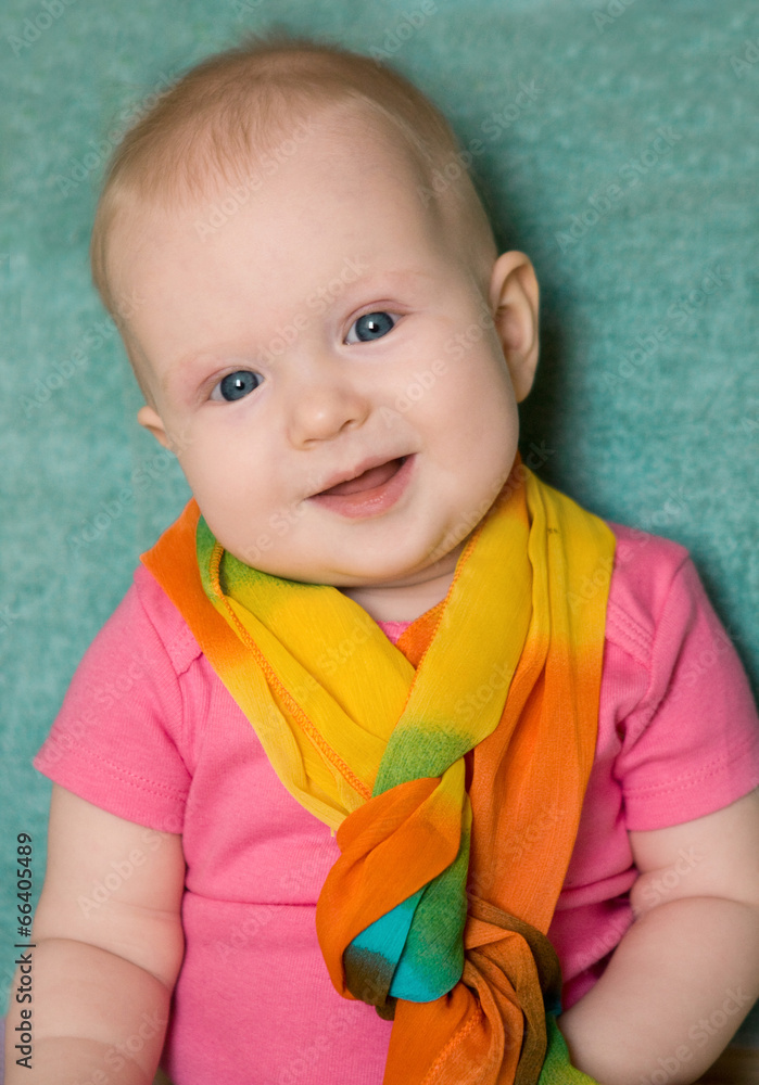 Baby girl in a pink t-shirt on green Baby girl in a pink t-shirt on green