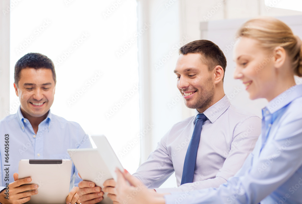 business team working with tablet pc in office business team working with tablet pc in office
