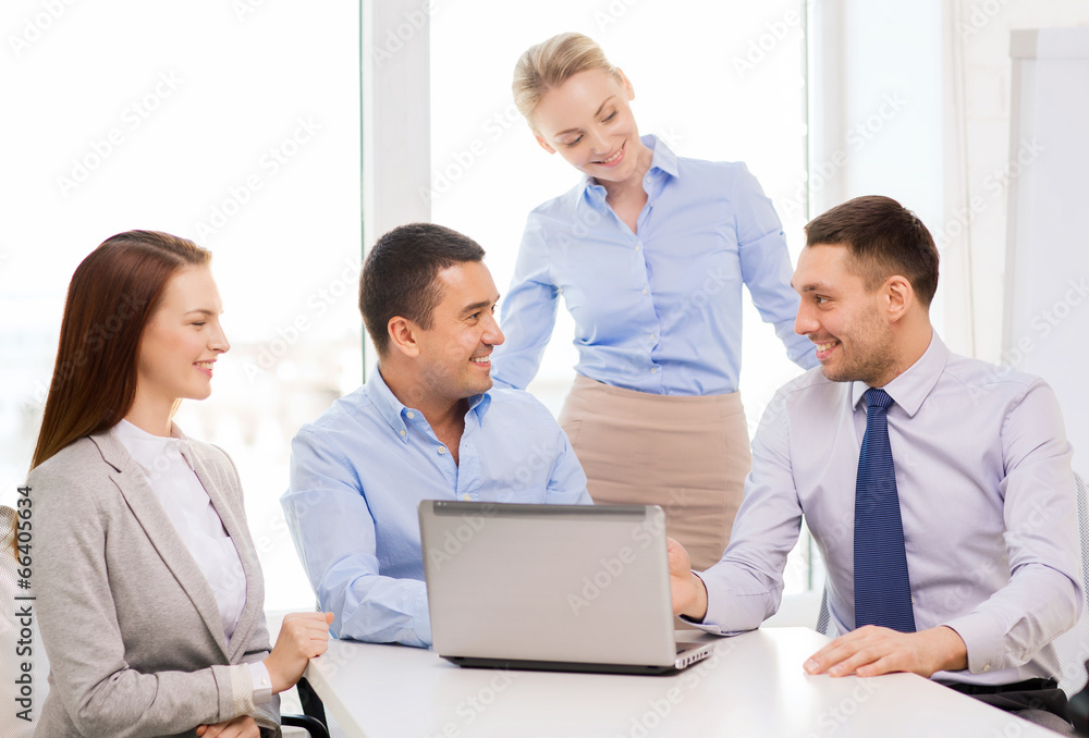 business team working with laptop in office business team working with laptop in office