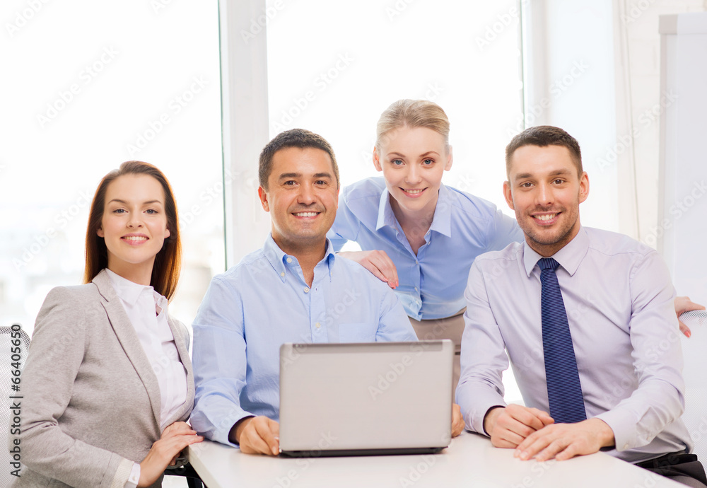 business team working with laptop in office business team working with laptop in office