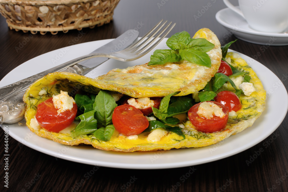 Omelet with spinach, basil, cherry tomatoes and cheese Adyg Omelet with spinach, basil, cherry tomatoes and cheese Adyg