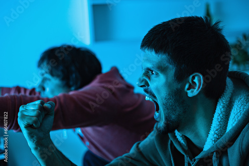 Friends watching sports on TV