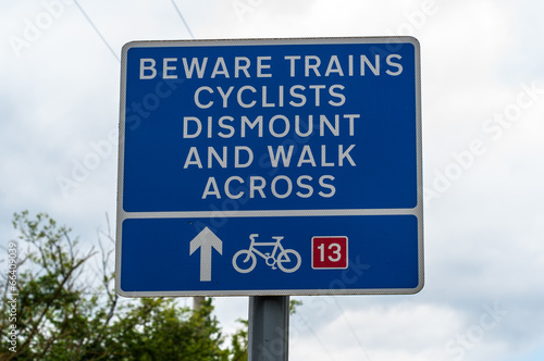 Beware trains cyclists dismount and walk across