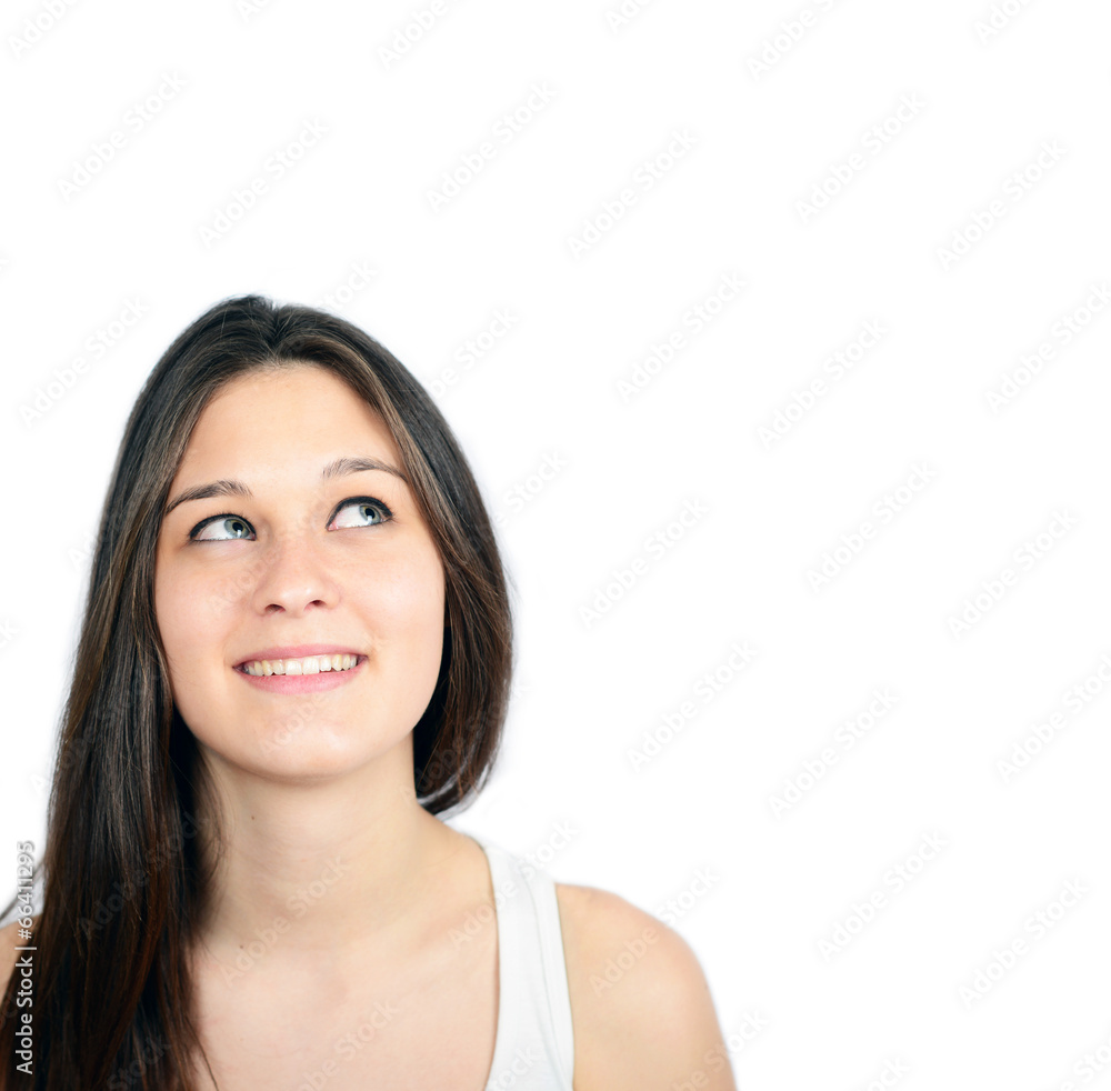 Portrait of beautiful girl thinking and looking up against white Portrait of beautiful girl thinking and looking up against white