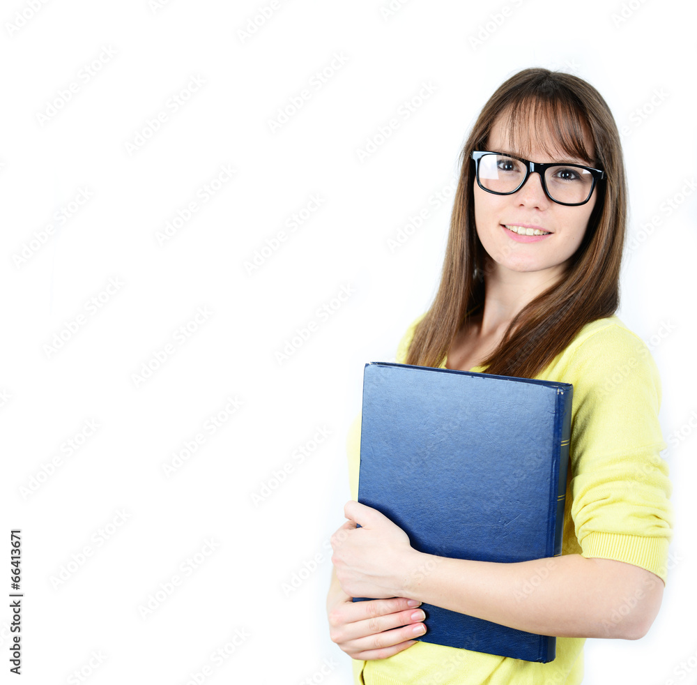 Happy young student women holding books in her hand while standi Happy young student women holding books in her hand while standi
