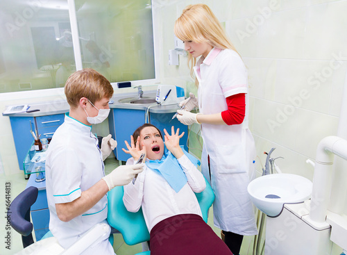 Female patient in dentist office scared, afraid doctor procedure