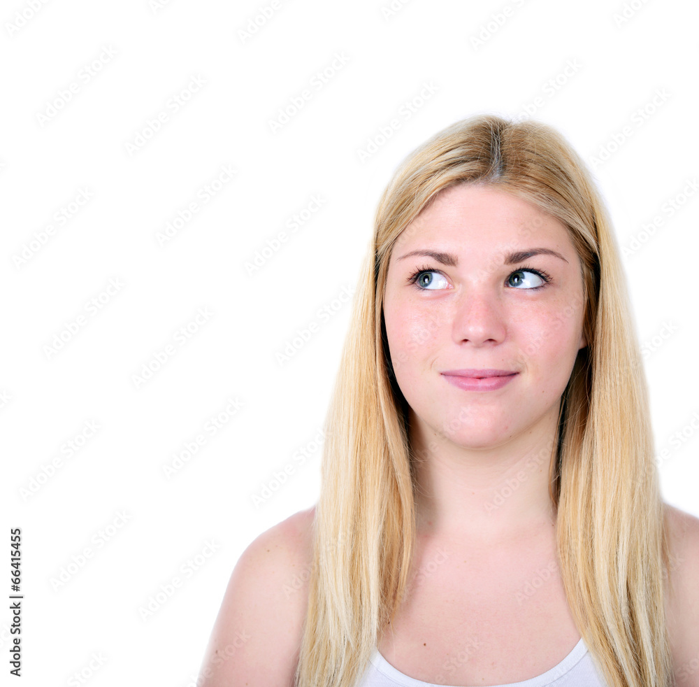 Portrait of beautiful girl thinking and looking up against white Portrait of beautiful girl thinking and looking up against white