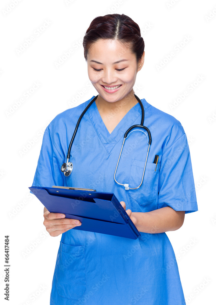 Female doctor write on clipboard Female doctor write on clipboard