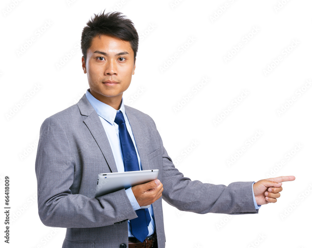 Asian businessman with tablet and finger point aside Asian businessman with tablet and finger point aside