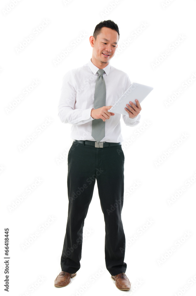 Asian business man using tablet computer isolated on white backg Asian business man using tablet computer isolated on white backg