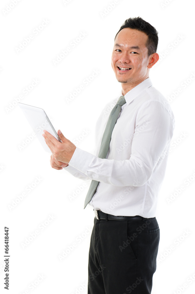 Asian business man using tablet computer isolated on white backg Asian business man using tablet computer isolated on white backg