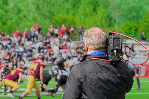 Recording the American football game.