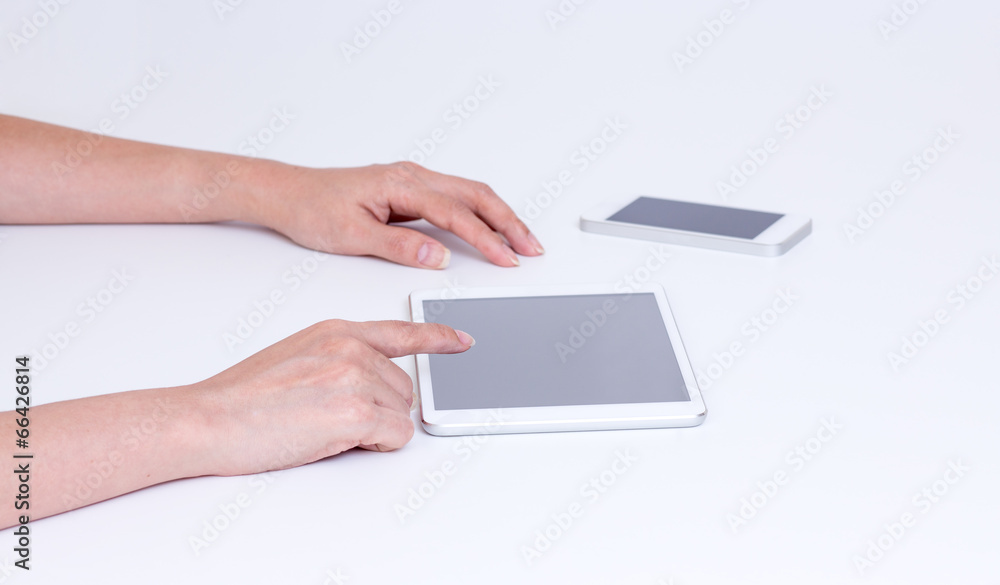 Women hands touching tablet screen Women hands touching tablet screen