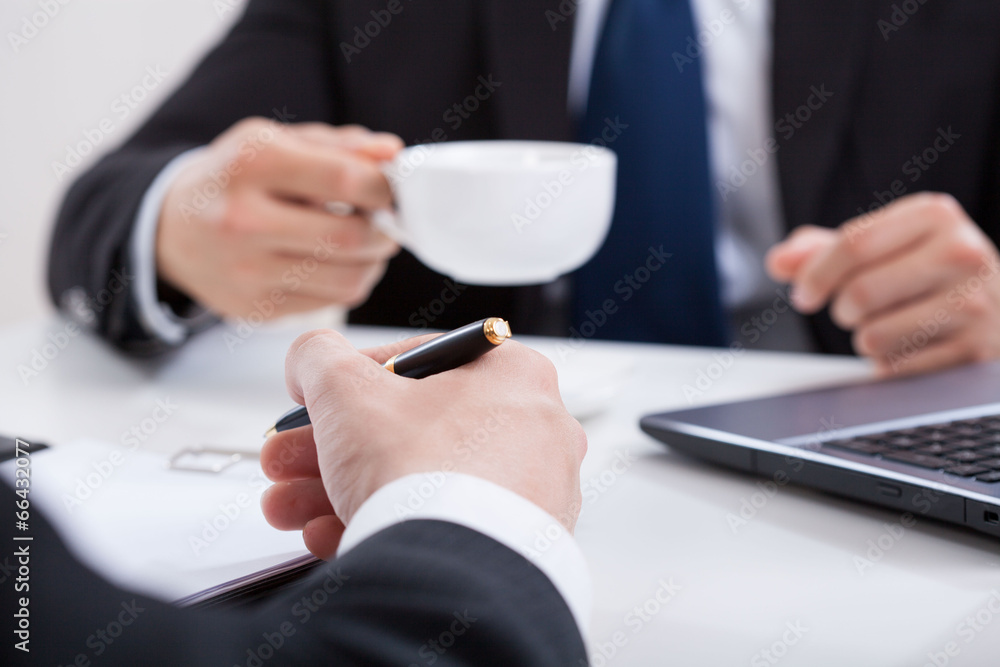 Man drinking coffee on a meeting Man drinking coffee on a meeting