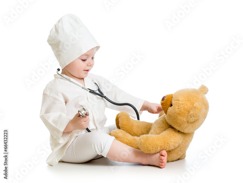 child girl playing doctor w...