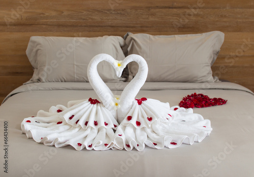 Bedroom interior design with swans from the towel decoration on