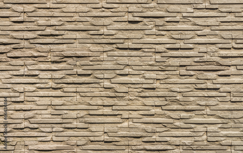 Obraz premium The stone wall for background and texture
