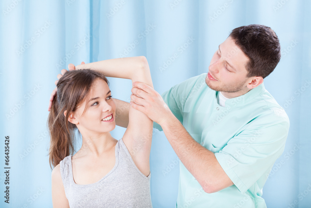 Physiotherapist and his female patient Physiotherapist and his female patient