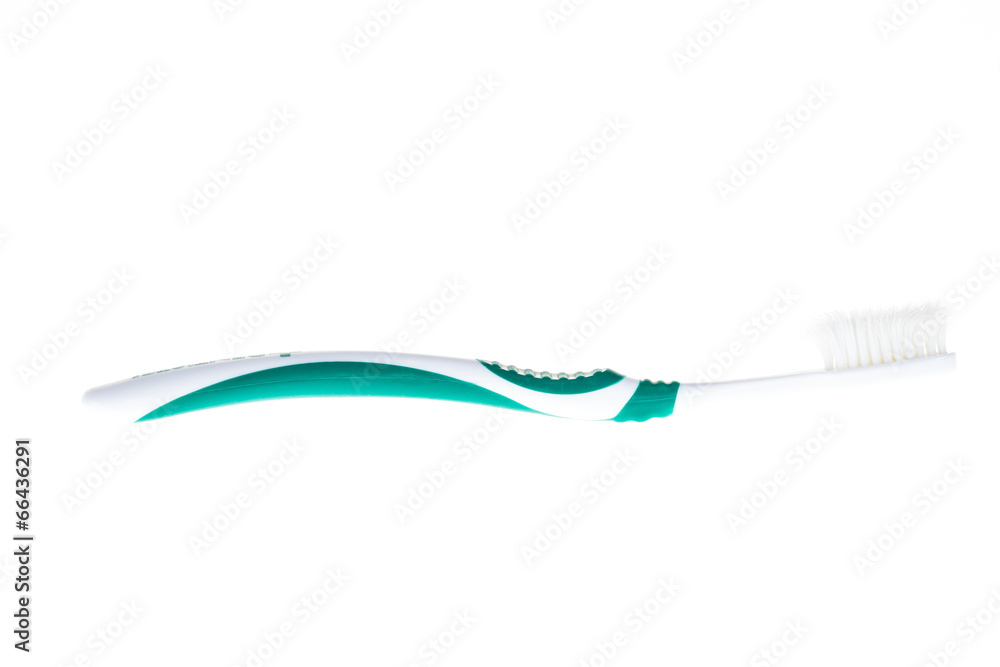 Green worn toothbrush on isolated white background Green worn toothbrush on isolated white background