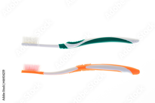 Two Color worn toothbrush on isolated white background