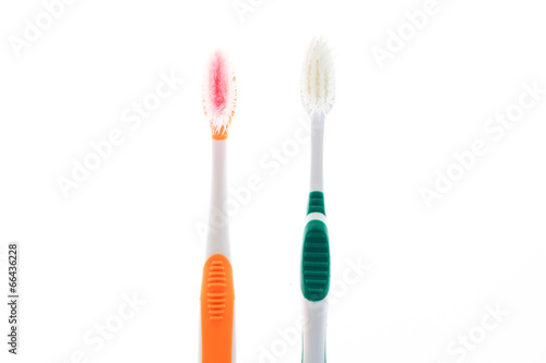 Two Color worn toothbrush on isolated white background