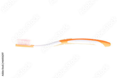 Orange worn toothbrush on isolated white background