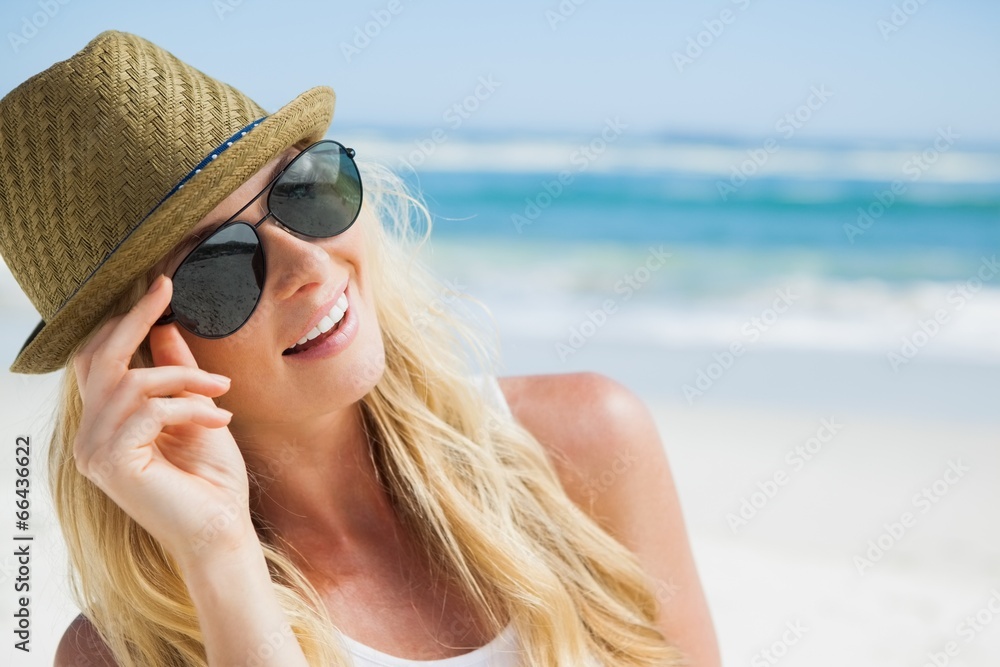 Stylish blonde smiling on the beach Stylish blonde smiling on the beach