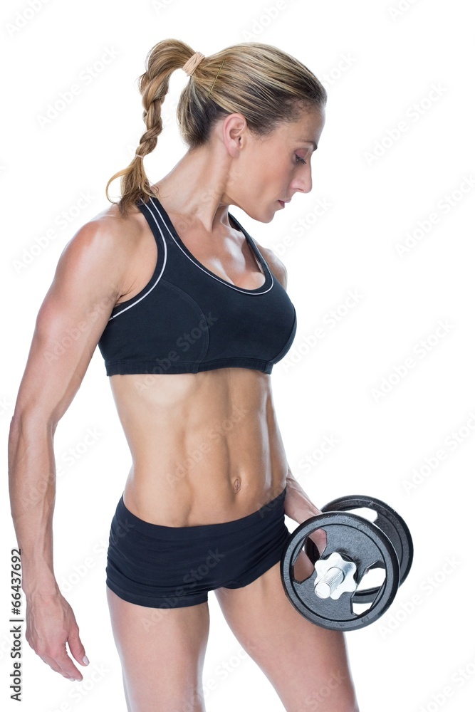 Female blonde bodybuilder holding large black dumbbell Female blonde bodybuilder holding large black dumbbell