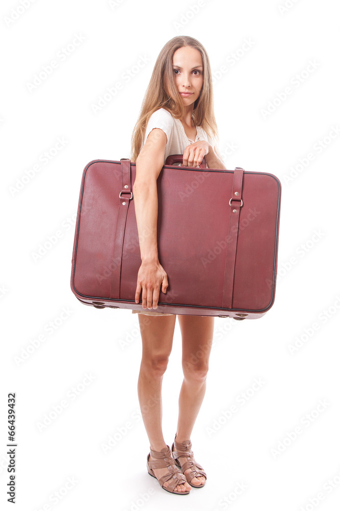 woman lifts a heavy suitcase, isolated on white woman lifts a heavy suitcase, isolated on white