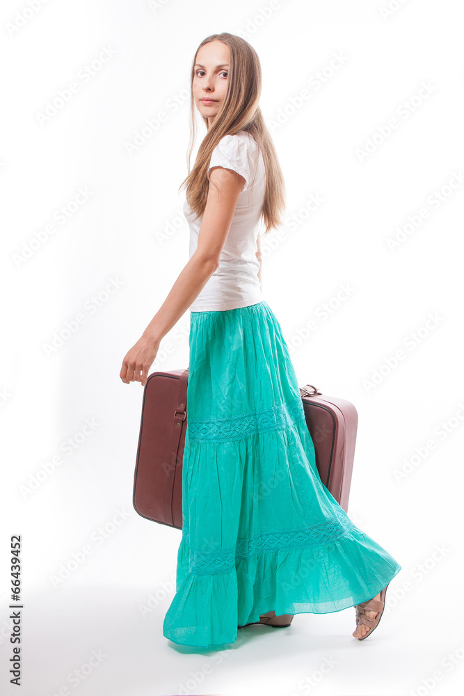 woman going with heavy suitcase, isolated on white