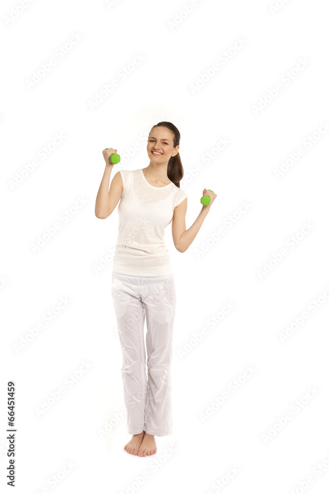 Young girl with dumbbells on a white background. Green Young girl with dumbbells on a white background. Green