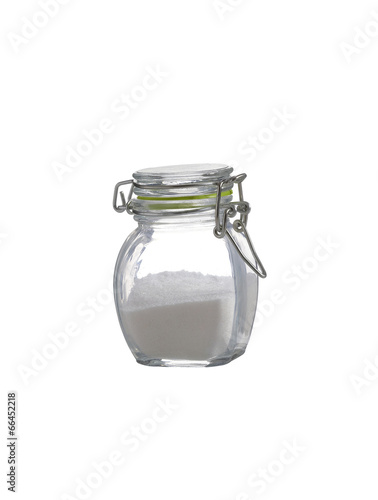 salt in glass bottle on white background