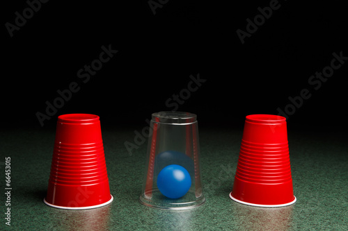 Tableau sur toile Blue Ball Hidden Under Clear Cup
