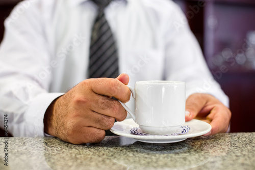 Barista holding take a coffee cup