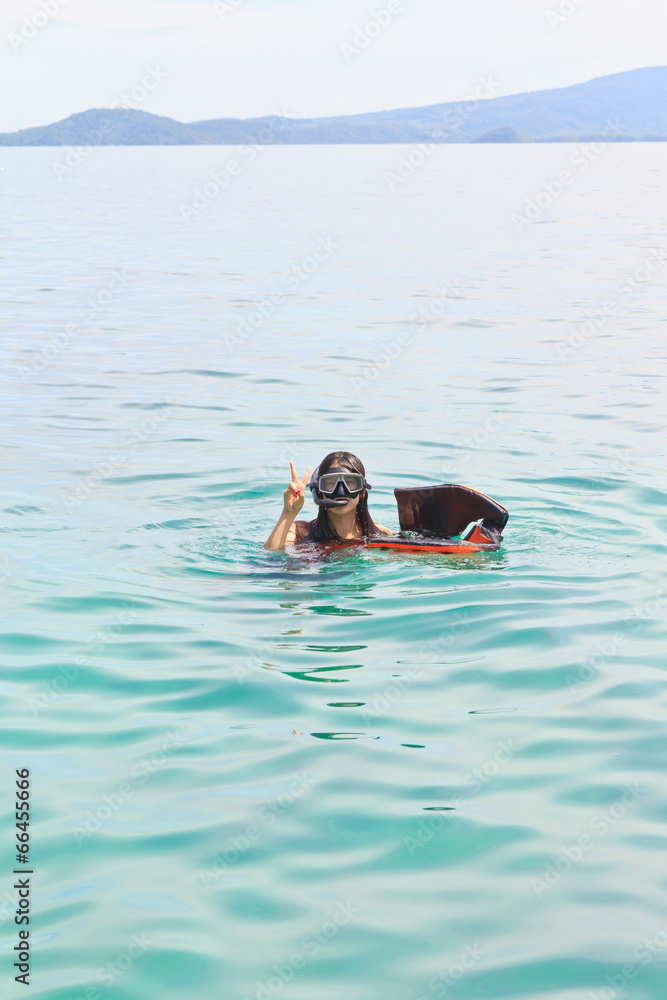 A woman swimming snorkeling in the sea