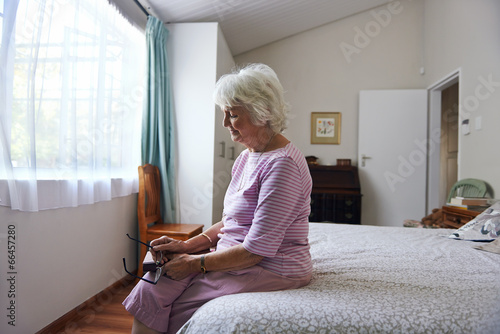 lonely granparent alone in bedroom